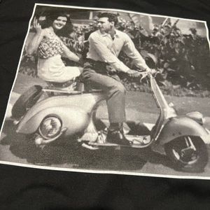 Vintage pic of couple on a Vespa. Classic